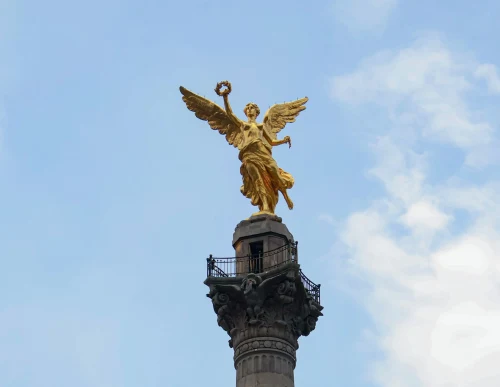 The Angel of Independence monument in Mexico City against a blue sky