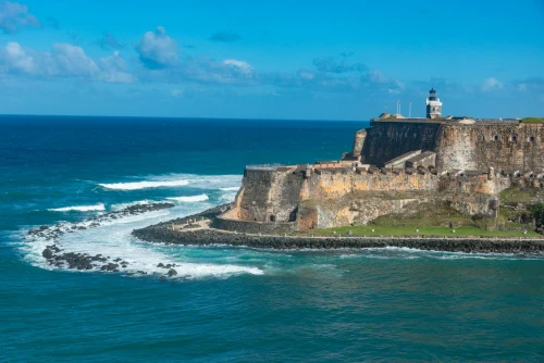 Aerial shot of Castillo San Felipe del Morro on a sunny day, overlooking the sea