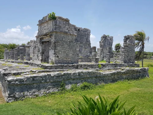 Explore the historic Mayan ruins of Tulum, Mexico, under a clear blue sky