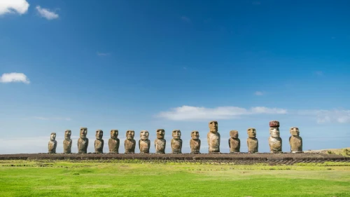 Discover the iconic moai statues on Easter Island against a vibrant blue sky in Chile