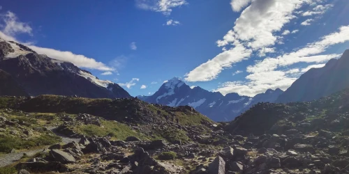 view of Aoraki Mount Cook in New Zealand under a vibrant blue sky, ideal for nature enthusiasts