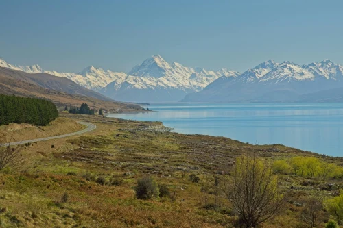 panorama of Mount Cook and Lake Pukaki in Canterbury, New Zealand under a clear blue sky