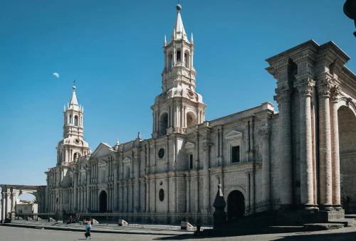 The majestic Basilica Cathedral of Arequipa under a clear blue sky, showcasing its classic architecture