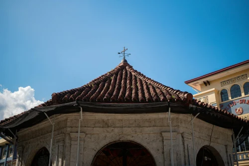 Historic Magellan's Cross Pavilion in Cebu City under a clear blue sky