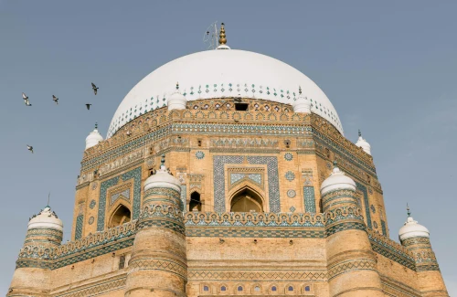 The stunning architectural details of the Tomb of Shah Rukn-e-Alam in Multan, Pakistan under a blue sky