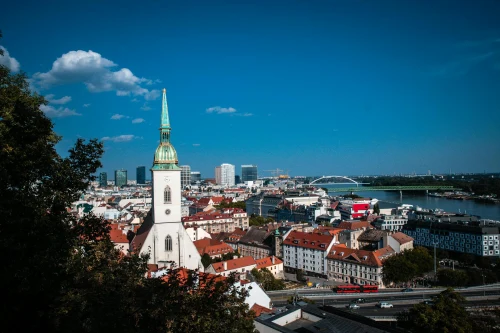 Stunning view of St. Martin's Cathedral with Bratislava skyline and Danube River under a clear blue sky