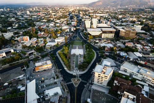 Stunning aerial shot of San Salvador's cityscape centering on the iconic Monumento al Divino Salvador del Mundo