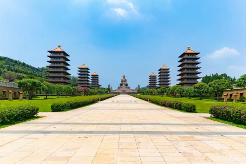 Stunning view of Fo Guang Shan temple with pagodas under a clear blue sky in Kaohsiung, Taiwan