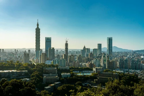 Stunning aerial shot of Taipei cityscape with the iconic Taipei 101 and clear blue sky