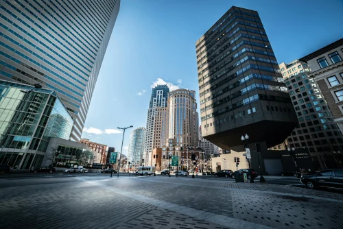 A vibrant view of Boston's downtown area showing iconic skyscrapers against a clear blue sky