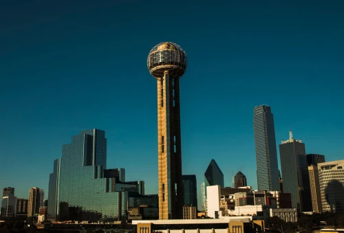 Iconic Dallas skyline with Reunion Tower under a clear blue sky