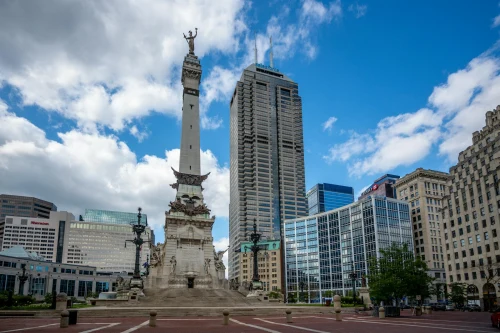 View of the Soldiers and Sailors Monument with Indianapolis skyline under a clear blue sky