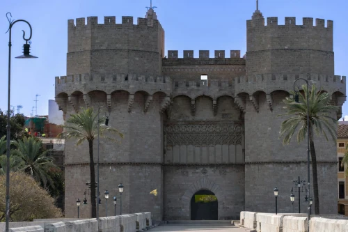 View of the iconic Serranos Towers in Valencia, showcasing medieval architecture under a clear sky