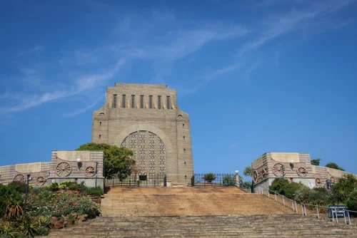 A stunning view of the historic Voortrekker Monument in Pretoria against a blue sky